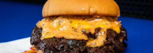 A Burger Bodega halal smashburger with crispy edges on a potato bun