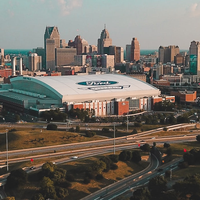Downtown Detroit skyline in daylight with Ford Field and the Renaissance Center