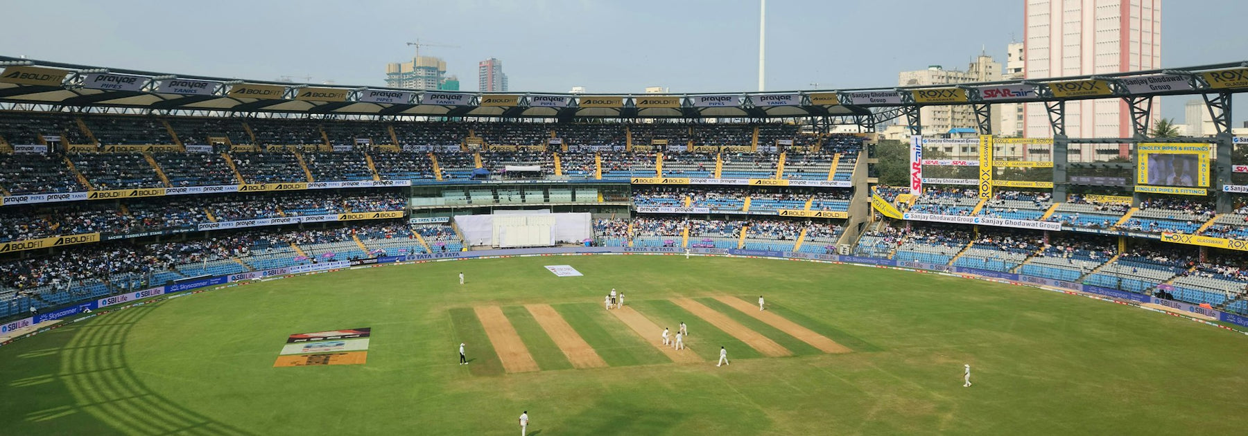 A packed cricket stadium, the kind of scene families will be watching during the 2026 Asian Games