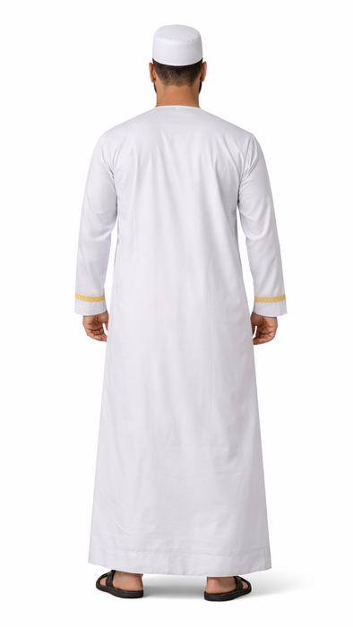 Man wearing a white traditional thobe, a Muslim prayer outfit, with gold accents, shown from back on a white background.