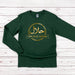 a green long sleeve shirt with gold arabic writing