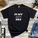 a black t - shirt with the words in my aru era printed on it