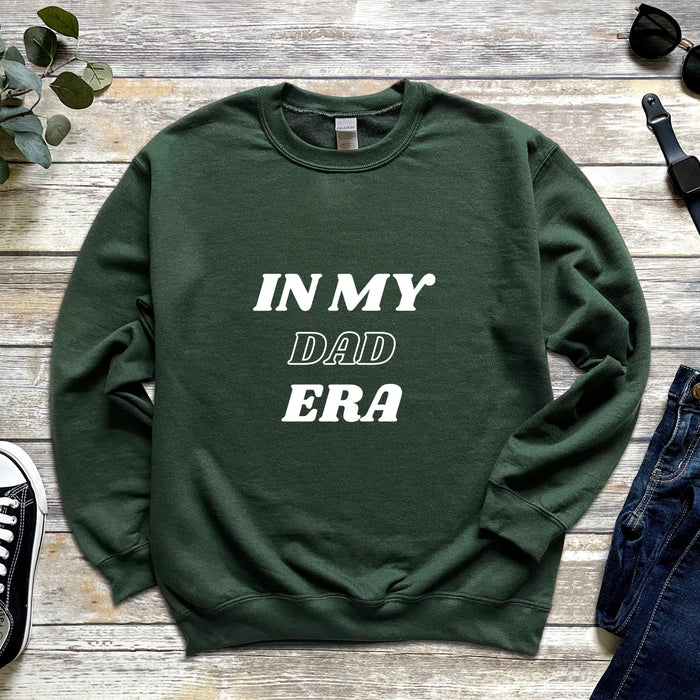 a green sweatshirt with the words in my dad era printed on it