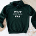 a green hoodie that says in my boy dad era