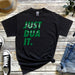 a t - shirt that says just dua it next to a pair of jeans