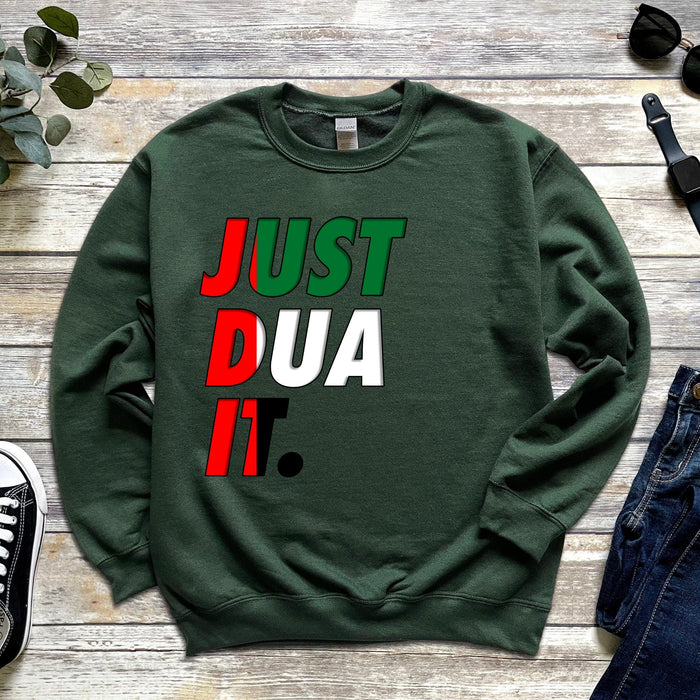 a green sweatshirt with the words just dua it printed on it