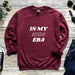 a maroon sweatshirt with the words in my area printed on it