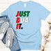 a t - shirt that says just dua it next to a pair of jeans